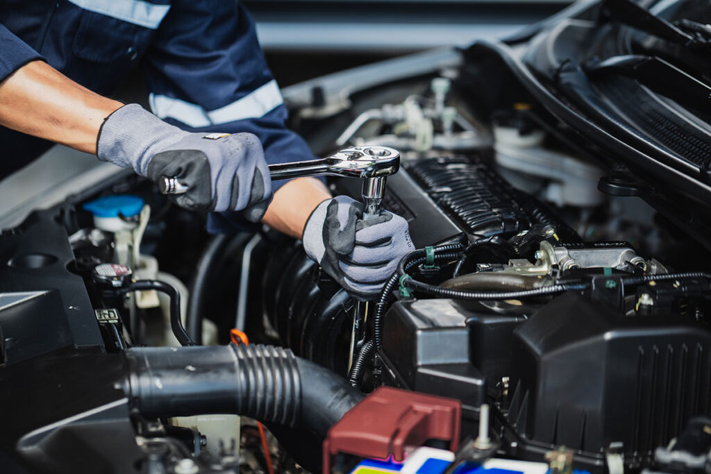 car mechanic repairing engine