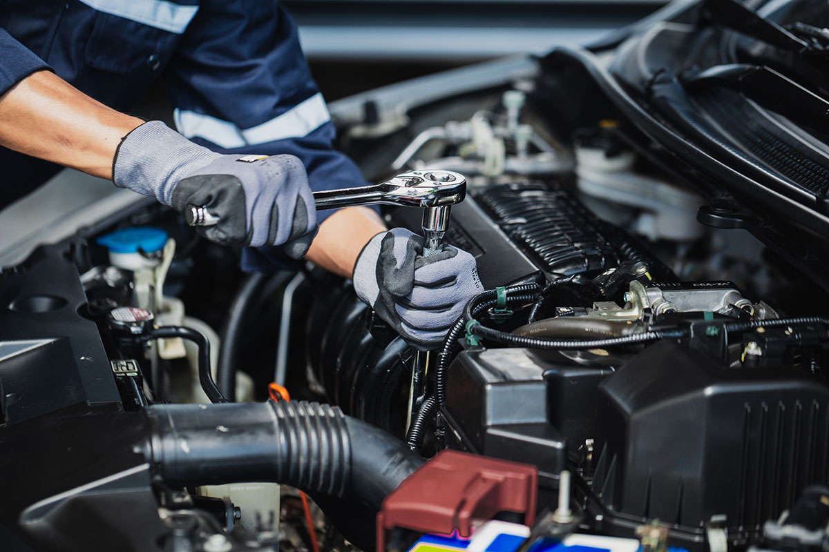 car mechanic repairing engine