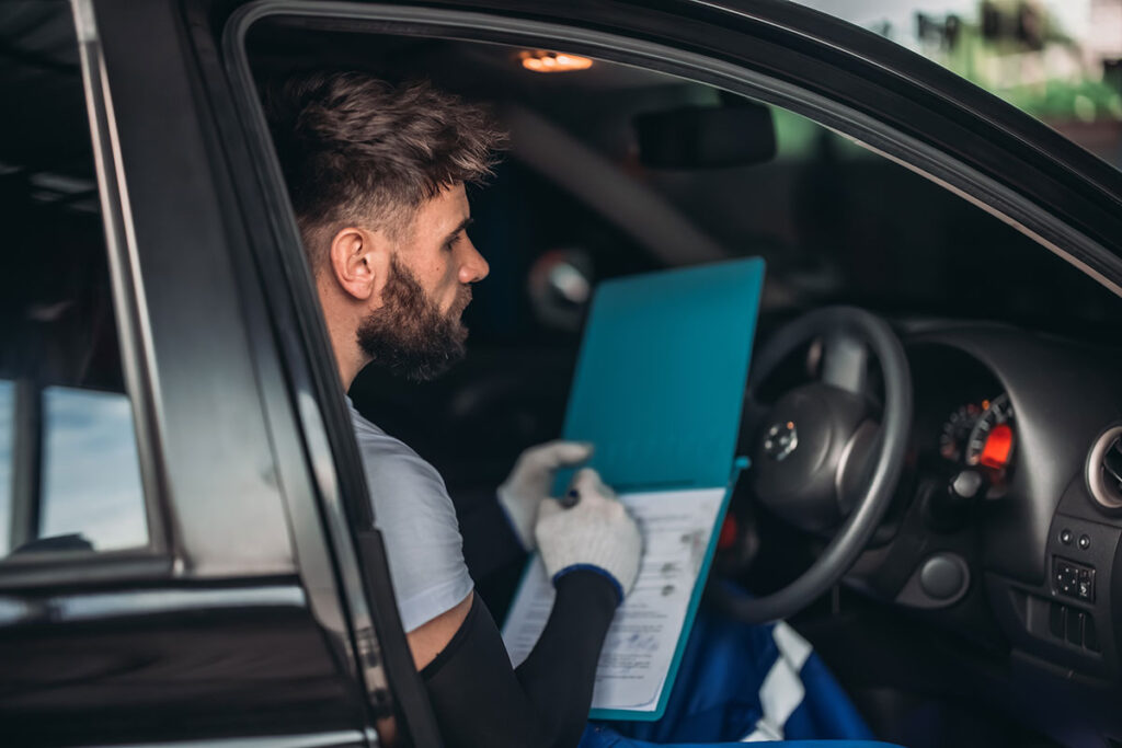 mechanic checking car